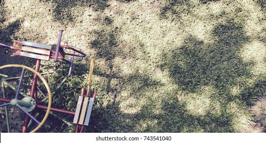 Colorful Traditional Metal Carousel/merry Go Round/roundabout On Playground In Sunny Day With Copy Space Of Shadow Of Trees On Lawn As Background - Childhood Holiday Joyful Memory Concept - Top View