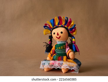 Colorful traditional Mexican doll, handmade by a member of an ethnic group called "Otomies". doll with braids and precious ribbons.