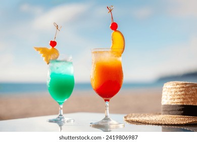 Colorful tropical cocktails on beach table with sea view. Summer vacation and travel. - Powered by Shutterstock