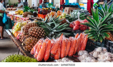 Colorful tropical fruits and vegetables at famous food market in Sir Selwyn Selwyn Clarke Market at Mahe island, Seychelles - Shutterstock ID 1696870333