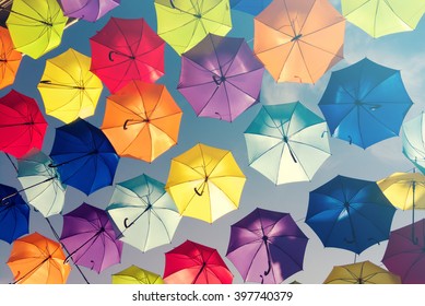 Colorful umbrellas background. Colorful umbrellas in the sky. Street decoration. - Shutterstock ID 397740379