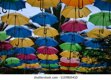 Colorful umbrellas line Giralda Plaza as part of the Umbrella Sky Project in Coral Gables Florida August 18, 2018. Umbrella Sky, a creation of the Portuguese Company Sextafeira, which means Friday.