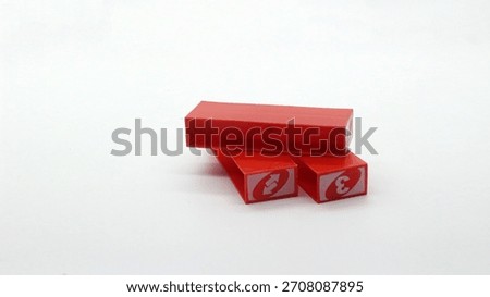 Colorful uno stacko blocks being played on a white background