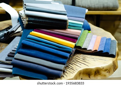 Colorful upholstery fabric samples in the store. Types Of Fabrics.