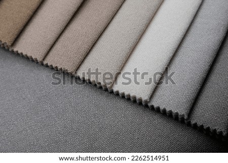 Colorful upholstery fabric samples.
Various fabric material sample.
Samples of fabrics of different quality and category for furniture upholstery.