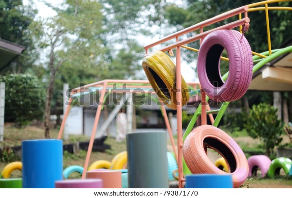 colorful used tires
playground in poor
school