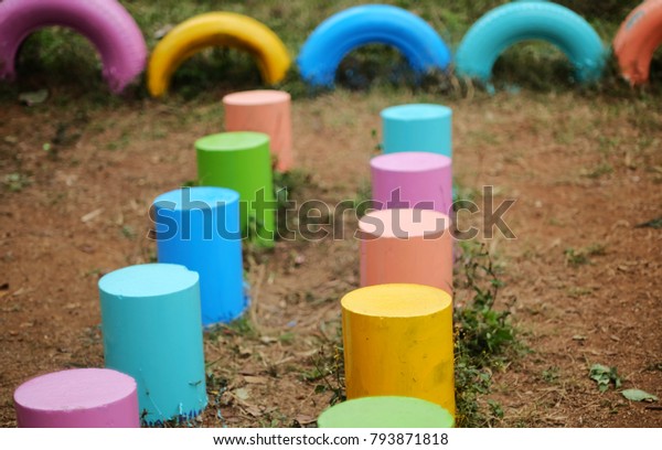 colorful used tires\
playground in poor\
school