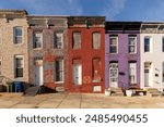 Colorful Vacant Row houses with do not enter symbols for the Fire Deparment in East Baltimore