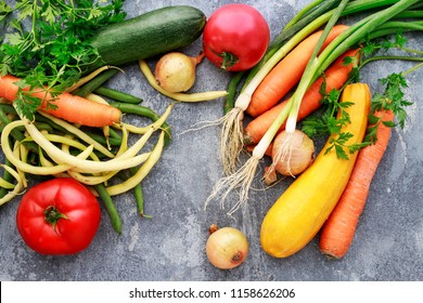 Colorful vegetables on grey stone background. 