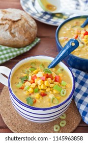 Colorful vegetarian corn chowder with red bell pepper and spring onion