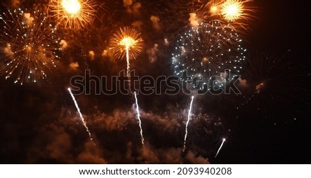 Colorful vibrant Firework celebrate anniversary happy new year 2022, 4th of july holiday festival. colorful firework in the night time to celebrate national holiday. countdown new year 2022 party time