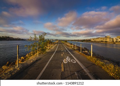 Colorful view of the Ballona Creek Bike Path at sunset surrounded by bodies of water on each side – Marina Del Rey on the left and Ballona Creek on the right, Marina Del Rey, California
