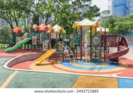 Colorful view of KLCC Park Playground. The deserted outdoor playground on hot sunny day. KLCC Park Playground is a popular attraction among children.