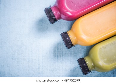 Colorful And Vivid Smoothies In Plastic Bottles