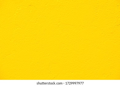 Colorful wall yellow paint on concrete wal background