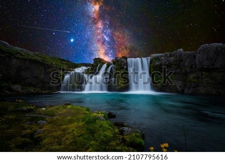 Colorful waterfall with milky way