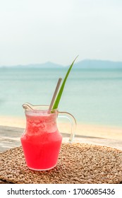 Colorful Watermelon Mocktail At The Beach Bar With Sea Background. Vacation, Get Away, Summer Outing Concept