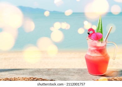 Colorful Watermelon Mocktail At The Beach Bar With Sea Background. Vacation, Get Away, Summer Outing Concept. Bokeh Effects