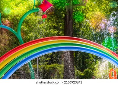 Colorful Waterpark For Kids With Funny Flower Showers And Rainbow Bridge