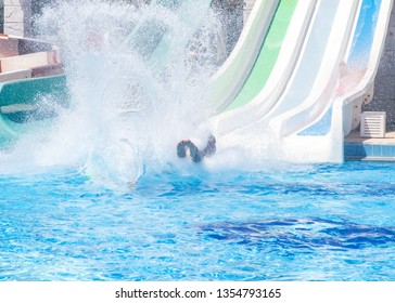 Colorful Waterpark Tubes, Spray Slides And Pool In Aquapark. Water Park Slides Close Up.