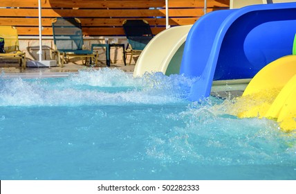 Colorful Waterpark Tubes And A Swimming Pool.