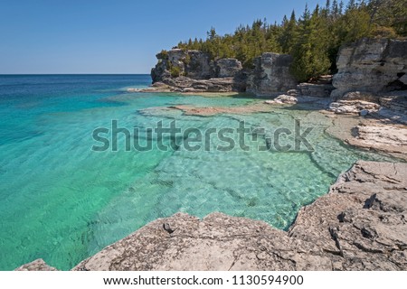 Colorful Waters on a Secluded Indian Cove on Lkae Huron in Bruce Peninsula National Pqrk in Ontario
