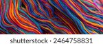 Colorful waves of vibrant, mixed rainbow colours of cotton thread, ready to be woven into traditional Guatemalan textiles. Abstract, fashion and travel, background texture banner. 