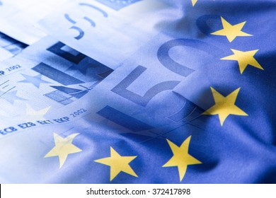 Colorful Waving European Union Flag On A Euro Money Background.