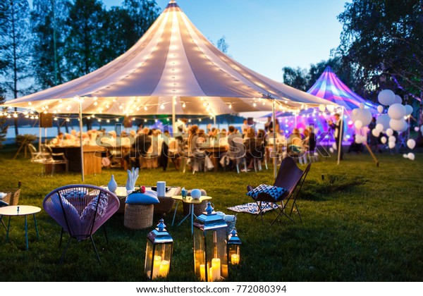 Colorful wedding\
tents at night. Wedding\
day.