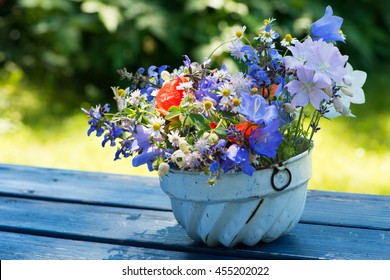 Colorful Wild Flowers In A Old Cake Tin