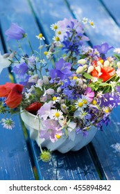 Colorful Wild Flowers In A Old Cake Tin