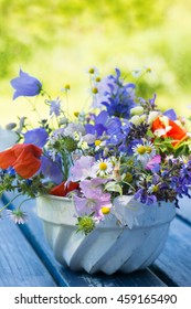 Colorful Wild Flowers In A Old Cake Tin