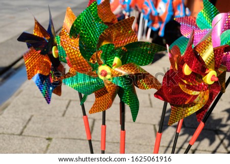 Colorful WindMill Toys shining in front of a shop Stok fotoğraf © 