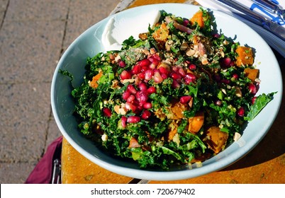 Colorful Winter Salad With Baby Kale, Roasted Butternut Squash And Pomegranate Seeds