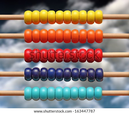 colorful wood abacus toy over blue sky