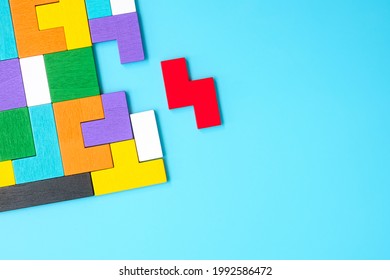 colorful wood puzzle pieces on blue background, geometric shape block. Concepts of logical thinking, Conundrum, solutions, rational, strategy, world logic day and Education - Powered by Shutterstock