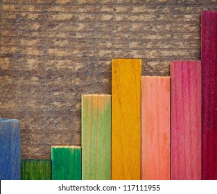 Colorful Wood Stain Color Test Samples, On Rough Wood. Arranged Like A Bar Graph.