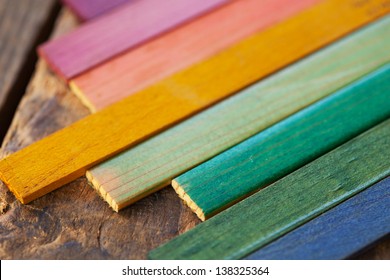 Colorful Wood Stain Color Test Samples, On Rough Wood. Shallow Depth Of Field.