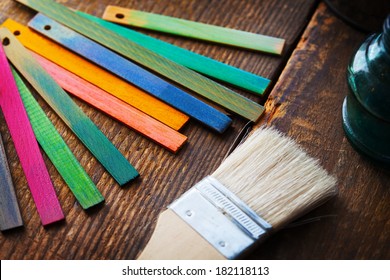 Colorful Wood Stain Or Dye Color Test Samples On Rough Wood Surface. Shallow Depth Of Field.