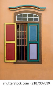 Colorful Wooden Abstract Window, Close Up . Colonial Style Architecture Building In Little India , Singapore City . Background And Texture Of Bright Architecture