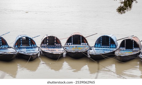 Colorful Wooden boats tied at hooghly ganges riverbank in kolkata. - Powered by Shutterstock