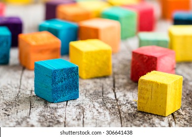 Colorful wooden building blocks. Selective focus - Shutterstock ID 306641438