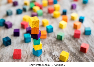 Colorful wooden building blocks. Selective focus - Shutterstock ID 379238365
