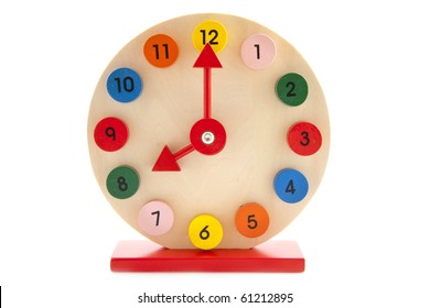 Colorful Wooden Clock Isolated On A White Background