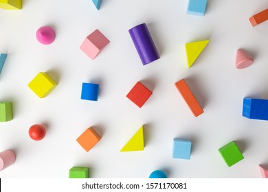 Colorful  wooden geometric shapes pattern on white background minimal creative concept.
