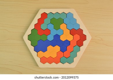Colorful wooden hexagon on the table. Top view.