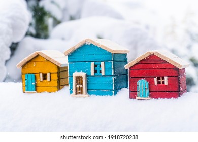 Colorful Wooden Model Homes In The Snow