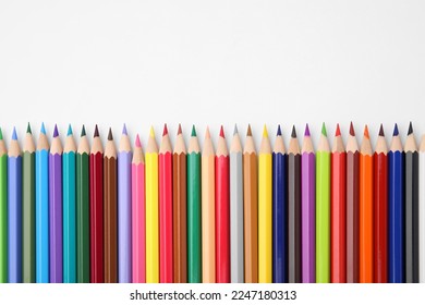 Colorful wooden pencils on white background, flat lay. Space for text - Powered by Shutterstock