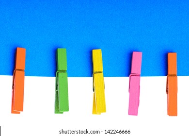 Colorful wooden pin with paper and copy space