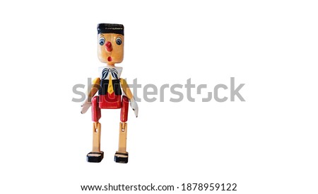 A Colorful Wooden Puppet "Pinocchio", The Symbol of Lying (Selective Focus).  Isolated, Die Cut on White Background with Copy Space for Text. Selection Path or Clipping Path Included.